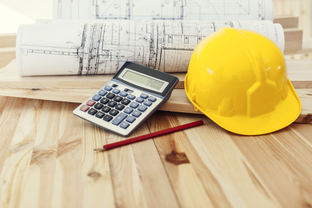 yellow-helmet-with-blueprints-calculator-wood.jpg